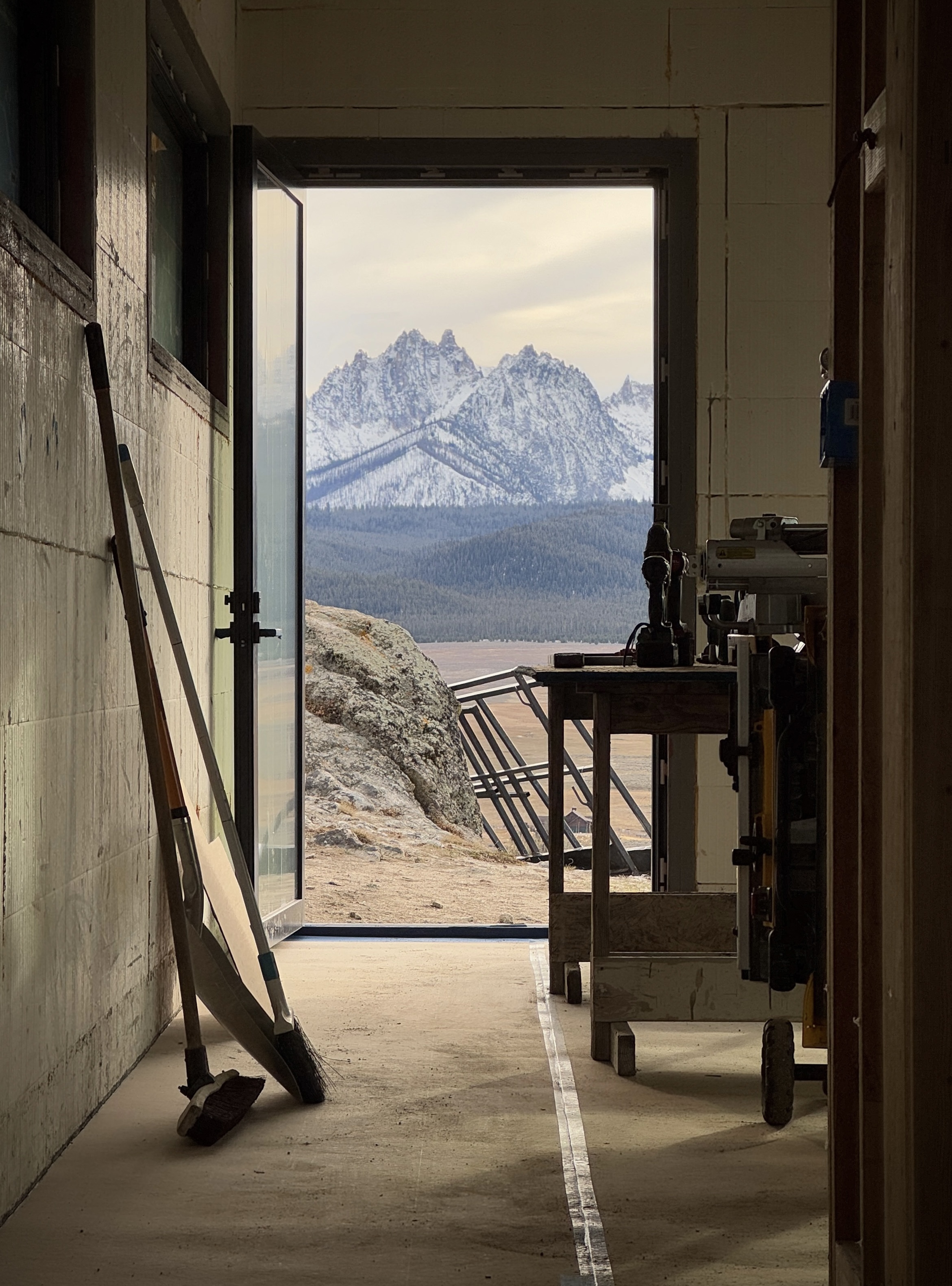 Framed view of Thompson Peak from a modern door designed in Stanley, ID.